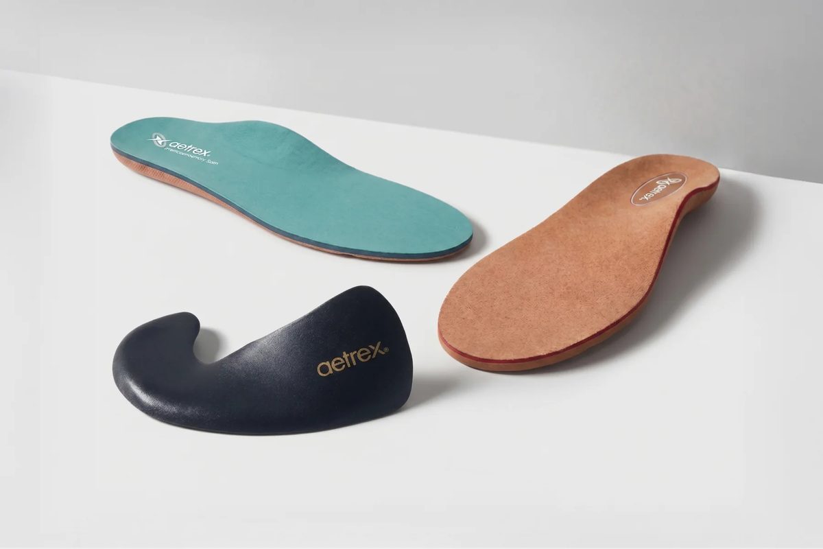 Three Aetrex premium memory foam orthotic insoles
